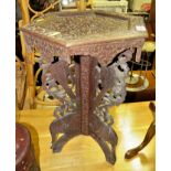HEAVILY CARVED INDIAN STYLE HEXAGONAL OCCASIONAL TABLE