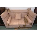 A drop-end Knoll sofa re-upholstered in pink and cream narrowly striped fabric with florets,