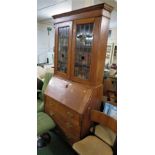OAK BUREAU BOOKCASE WITH LEADED AND STAINED GLASS DOORS TO TOP AND THREE DRAWERS TO BASE