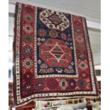 RED, BEIGE AND BLUE GROUND FLOOR RUG WITH FOUR LARGE CENTRAL MEDALLIONS