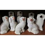 FOUR PAIRS OF STAFFORDSHIRE STYLE POTTERY SPANIELS