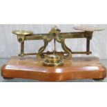 SET OF S MORDAN & CO BRASS POSTAGE SCALES AND WEIGHTS, ON MAHOGANY BASE