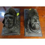 PAIR OF EBONISED WOODEN WALL BRACKETS CARVED AS MEDIEVAL STYLE HEADS