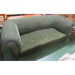 EDWARDIAN LOW SOFA WITH SCROLLED ARMS, STUFFED WITH HORSEHAIR AND IN MORE RECENT LOVAT GREEN