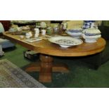 LARGE RUSTIC LIGHT OAK EXTENDING DINING TABLE ON SINGLE PEDESTAL BASE