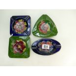 A collection of Walter Moorcroft ashtrays in the anemone and hibiscus designs (4)