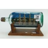 Ship in a bottle and oak stand 29.