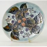 Moorcroft plate decorated in the bramble design,