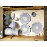 A collection of light blue Wedgwood items including plates, vases,