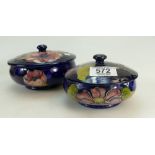 Walter Moorcroft round box & cover decorated in the anemone design (two 1cm fire cracks to base