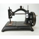 Cast iron sewing machine with arch top, mid to later 19th century.