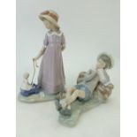 Lladro figure of girl with doll in toy cart similar figure of reclining boy(2)