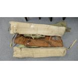Assorted WWII camp beds, roll mats,