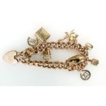 9ct hollow rose gold charm bracelet with assortment of charms. 28.2g gross.