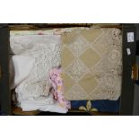 A collection of assorted vintage linen to include table cloths and Maltese lace items