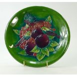 Moorcroft wallplaque decorated in the green finches design, diameter 26.