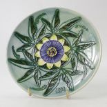 Moorcroft 1992 year plate decorated in the passion flower design,