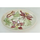Moorcroft oval dish decorated in the columbine design,