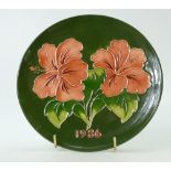 Moorcroft 1986 year plate decorated in the hibiscus design,