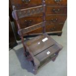 An early 20th century oak library chair