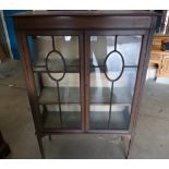 An early 20th Century two door inlaided display cabinet