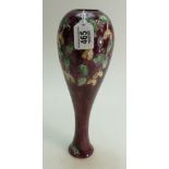 Lise B Moorcroft studio vase decorated with holly & mistletoe on maroon ground, dated 1989,