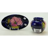 Moorcroft small round vase and ashtray Magnolia pattern in pink on blue ground.