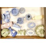 A collection of multi coloured Wedgwood items including money boxes, pin trays, vases,