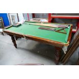 Early 20th Century pool/ snooker table with 6 vintage cues, triangle and score counter,
