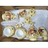 A collection of Aynsley Orchard Gold items including Pair of lidded urns,