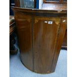 George III mahogany 2 door bow fronted corner cupboard, inlaid & crossbanded. Slight damages. 97.