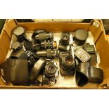 A collection of 35mm film camera and lens including Yashica FX-D, Practica BMS, Olympus OM10,