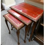 Nest of 3 carved oak Queen Anne tables with red leather gilded inserts