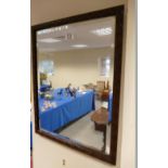 Carved oak framed bevel edged mirror