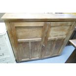 A large pitch pine 2 door cupboard
