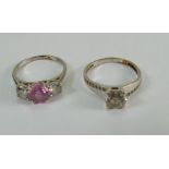 Two 9ct white gold gem set rings, single white stone size N, the pink central stone size M.