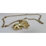 Large 9ct gold hallmarked hollow lion pendant 45cm wide, together with 9ct gold neck chain, 46cm.