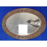 Carved Oak framed bevel edged oval wall mirror