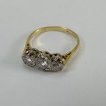 18ct yellow gold 3 stone diamond ring - 1 x 20 points & 2 x 10 points appx. Size K. 2.2g.