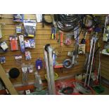 A mixed collection of items to include spirit levels, trowels, lock alarms, tool belts, pressure