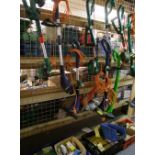 A quantity of untested strimmers together with screws, cable clips, metpost etc