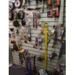 A mixed collection of items to include sanding discs, metal discs, wrenches, jigsaw blades, drill