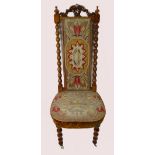 19th century carved walnut & tapestry prayer chair with bobbin twist sides