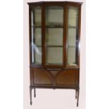 Edwardian mahogany inlaid display cabinet with single door beside canted sides above a drop down