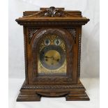 Large carved oak architectural three train movement bracket clock,