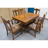 Flemish extending dining table with six oak chairs with heavily carved legs (7) (100cm wide x 150cm