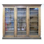 Late Victorian/20th Century large oak bookcase with three glazed doors and five adjustable shelves