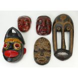 A collection of vintage tribal art masks