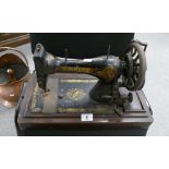 Early gilded singer sewing machine