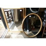 Oak framed oval wallmirror and gilt framed wall mirror: (2)